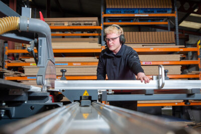 A photo of Shoptek employee making bespoke display furniture